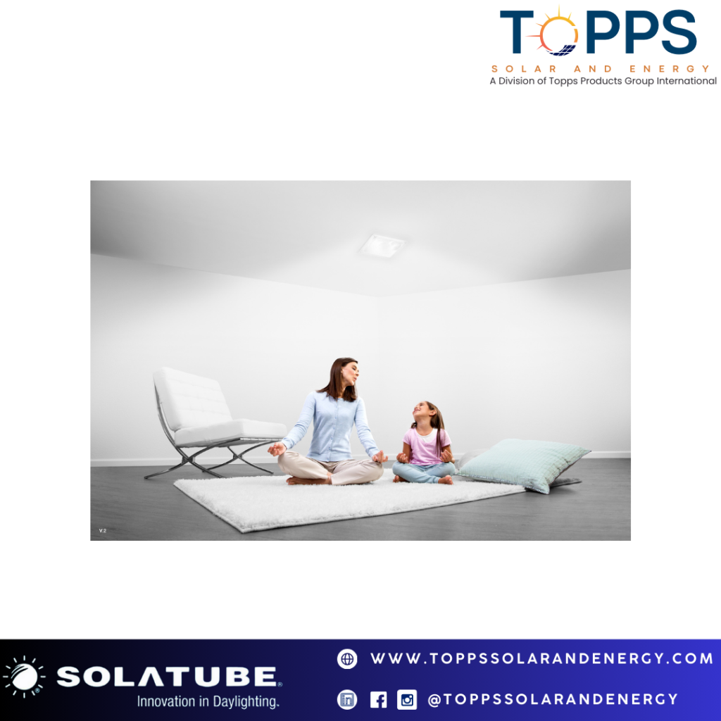 A mother sitting with her daughter in yoga pose